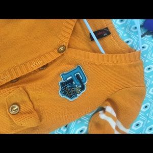 A orange pellepelle sweater